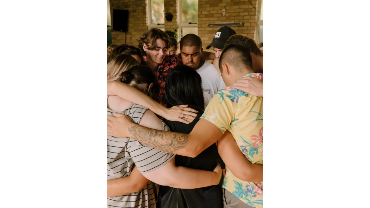 Students in prayer together